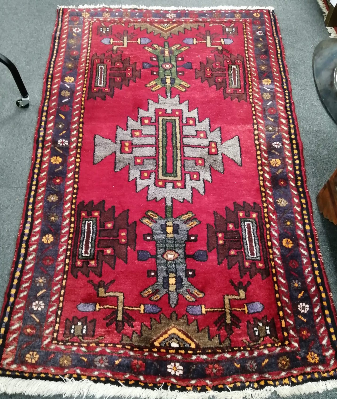 A Caucasian red ground rug, 160 x 100cm and similar runner